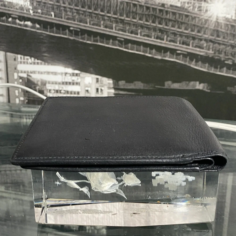 Authentic YSL Sleek black leather bifold wallet